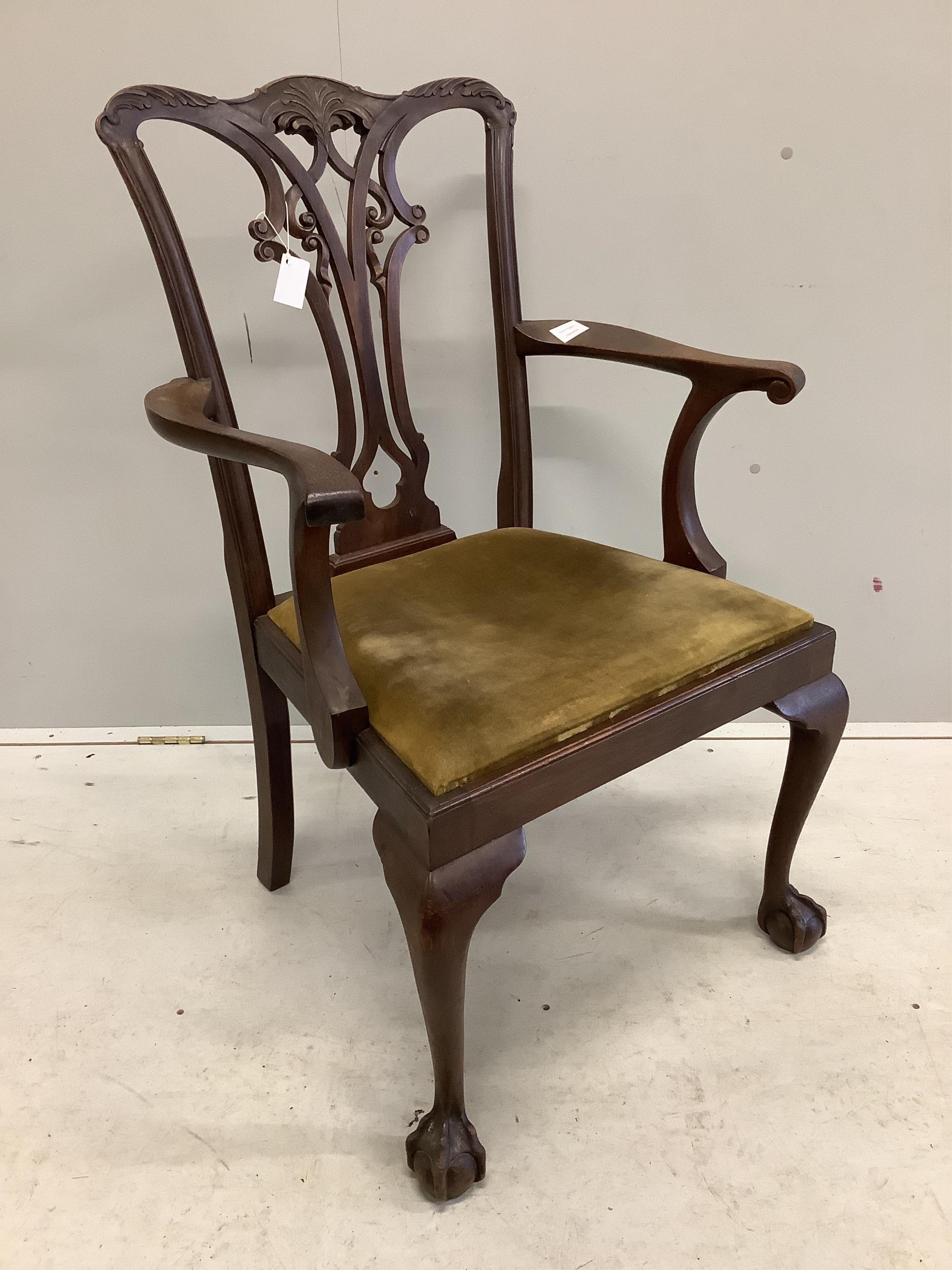 A George III Chippendale style mahogany elbow chair with a later similar elbow chair. Condition - fair